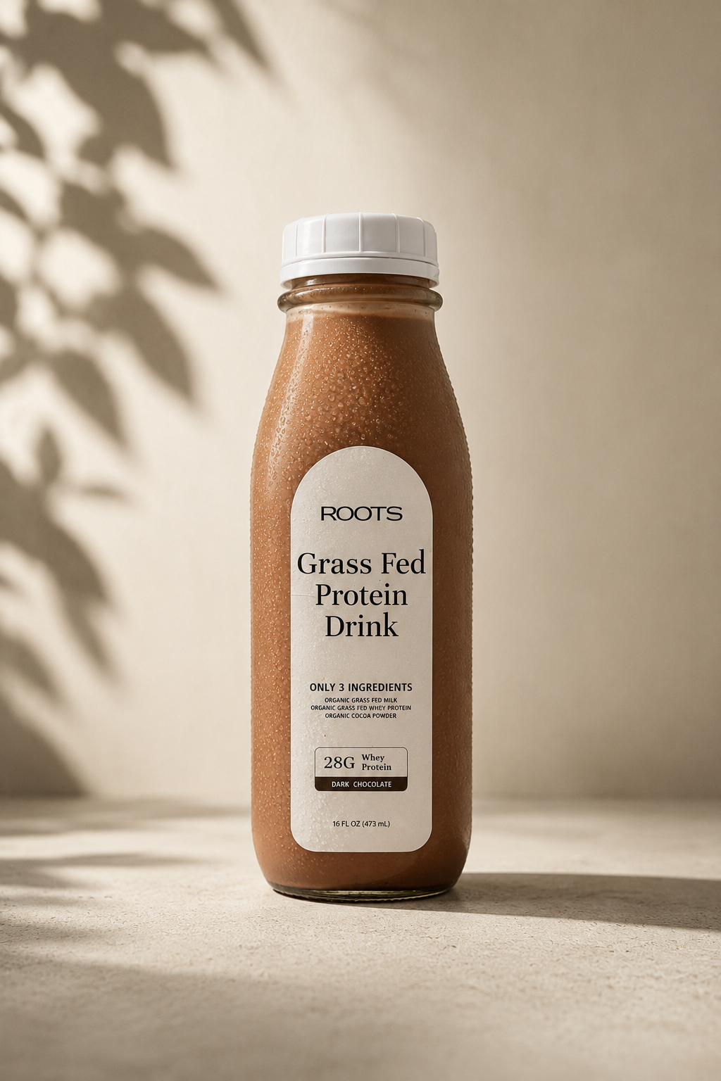Roots Dark Chocolate grass-fed protein drink, 16oz glass bottle